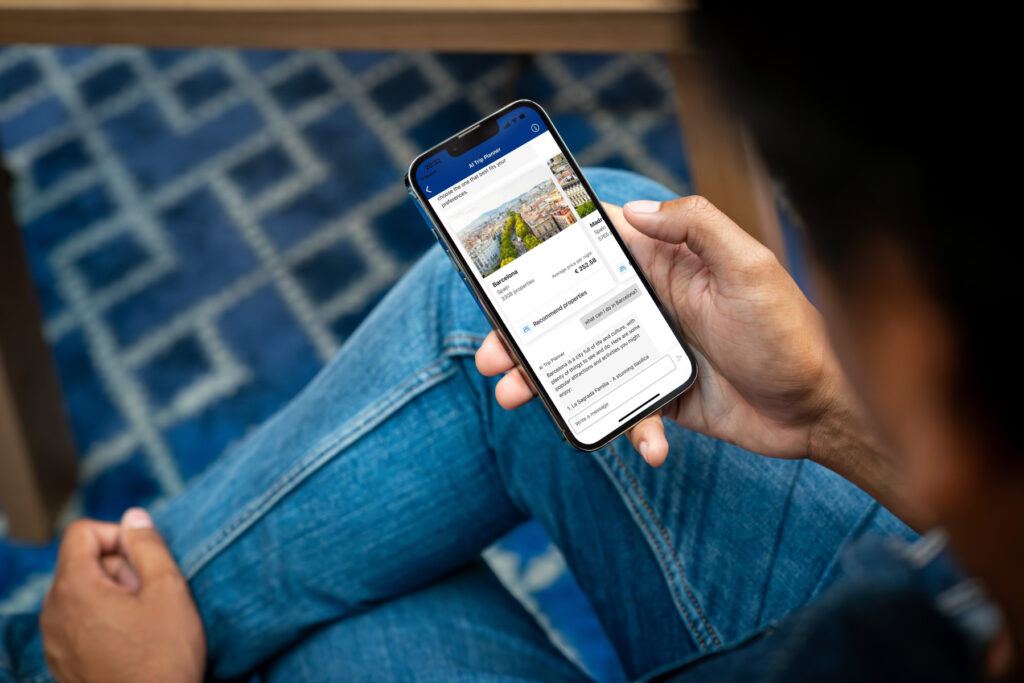 Person using a smartphone to browse and book wine tours online, showcasing the convenience of planning a Bordeaux wine tour with Decanter Tours.